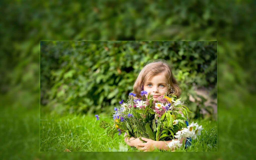 girl-holding-flowers-in-garden
